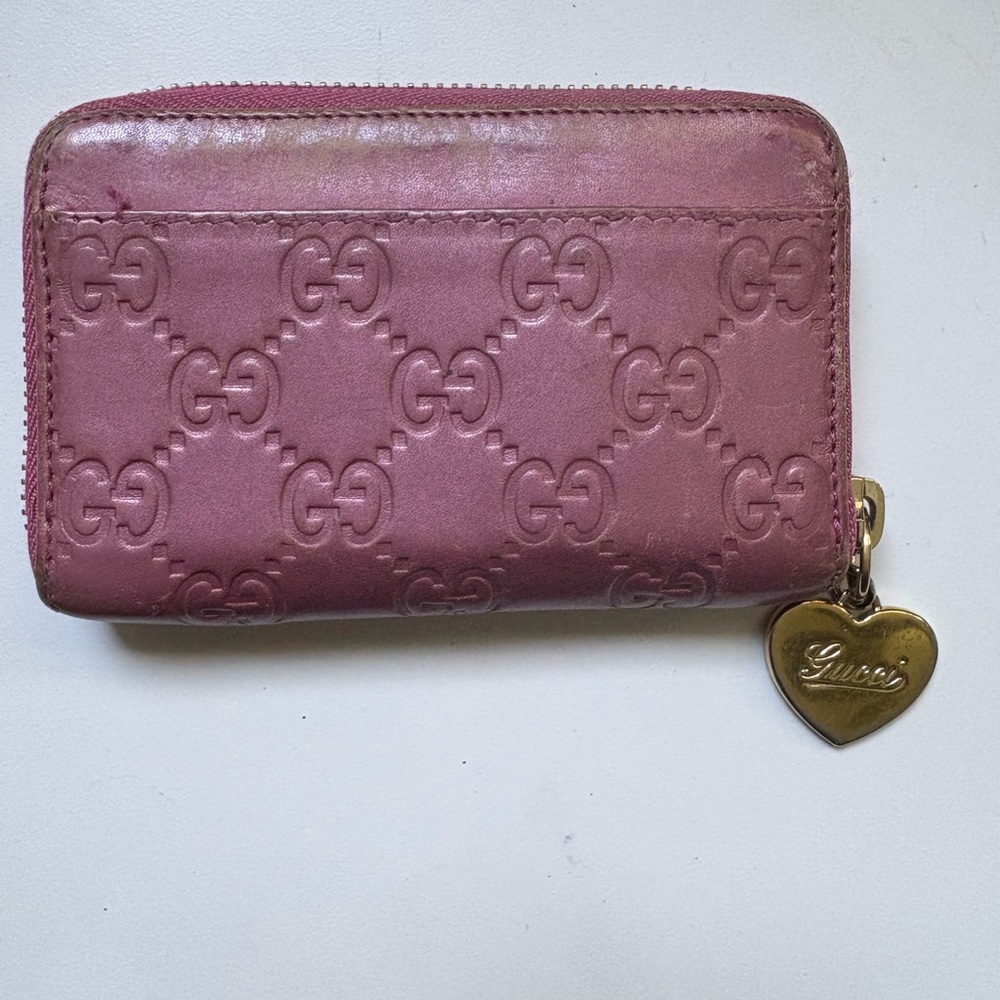 Gucci Pink Embossed GG Zip Wallet with Gold Heart Charm